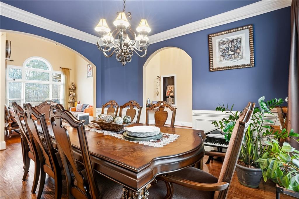 930 Old Tucker Road Stone Mountain, GA 30087 - Photo 22 of 47 a view of a dining room with furniture window and wooden floor