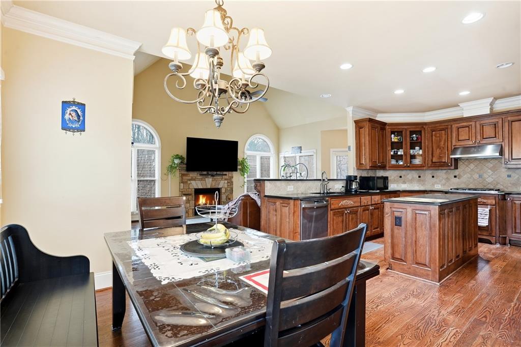 930 Old Tucker Road Stone Mountain, GA 30087 - Photo 24 of 47 a large kitchen with a table and chairs
