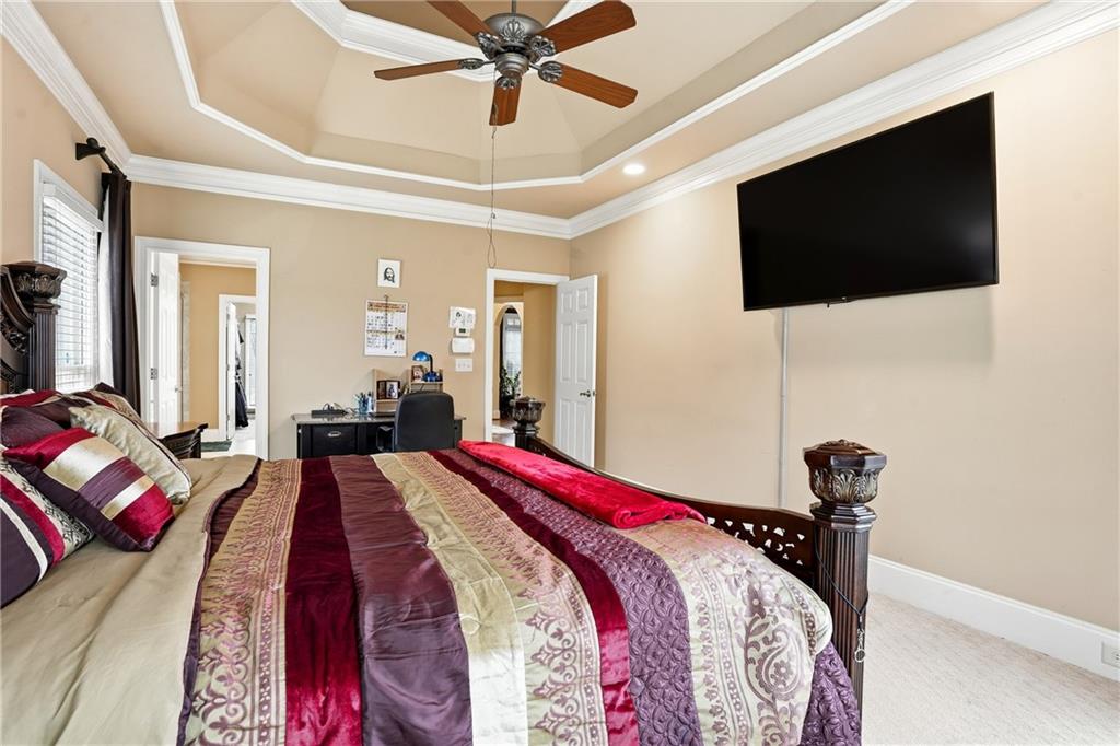 930 Old Tucker Road Stone Mountain, GA 30087 - Photo 28 of 47 a bedroom with a bed and a flat screen tv