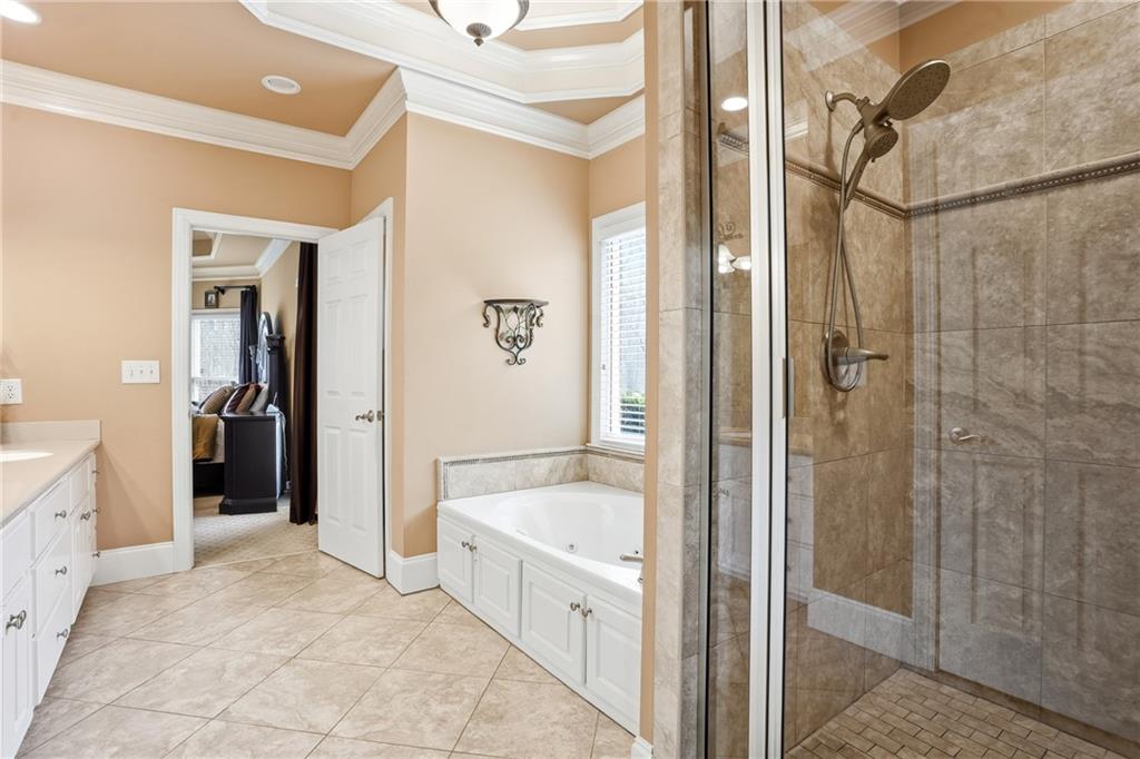 930 Old Tucker Road Stone Mountain, GA 30087 - Photo 31 of 47 a bathroom with a tub and shower