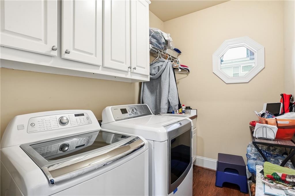 930 Old Tucker Road Stone Mountain, GA 30087 - Photo 33 of 47 a utility room with dryer and washer