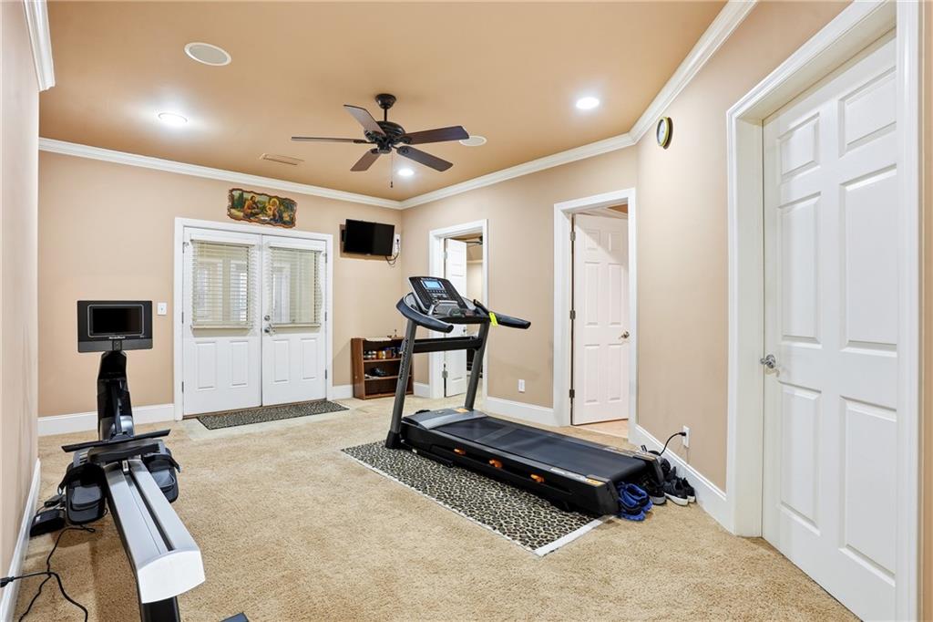 930 Old Tucker Road Stone Mountain, GA 30087 - Photo 37 of 47 a room with gym equipment and a wooden floor