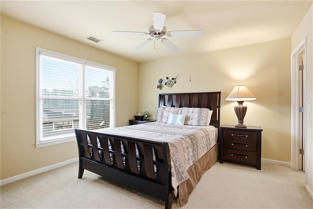 930 Old Tucker Road Stone Mountain, GA 30087 - Photo 41 of 47 a bedroom with a bed and a table