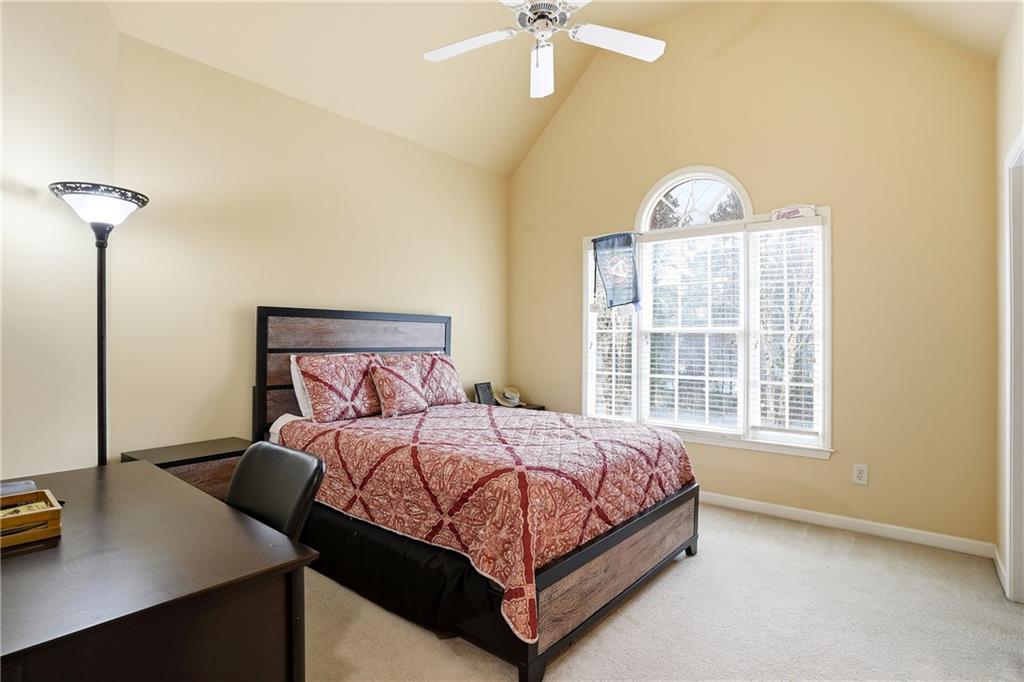 930 Old Tucker Road Stone Mountain, GA 30087 - Photo 45 of 47 a bedroom with a bed and a table