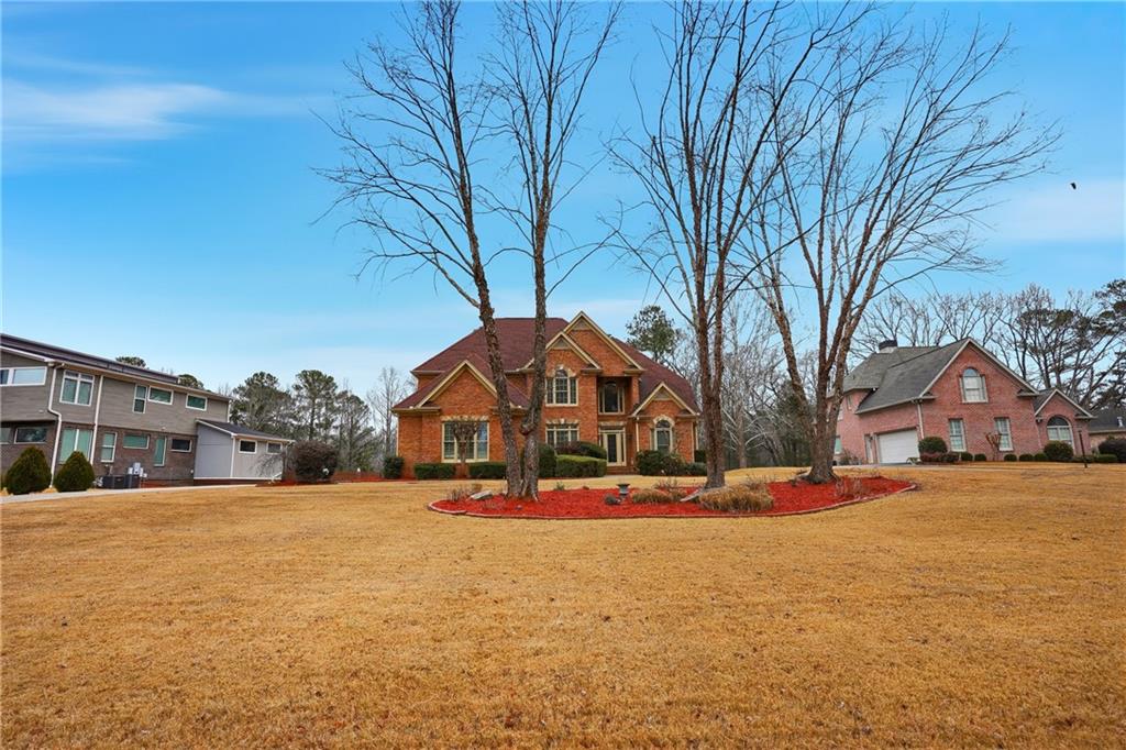 930 Old Tucker Road Stone Mountain, GA 30087 - Photo 5 of 47 a front view of a house with a yard covered with snow