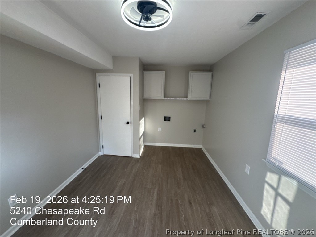 5240 Chesapeake Road Fayetteville, NC 28311 - Photo 20 of 20 an empty room with wooden floor and windows