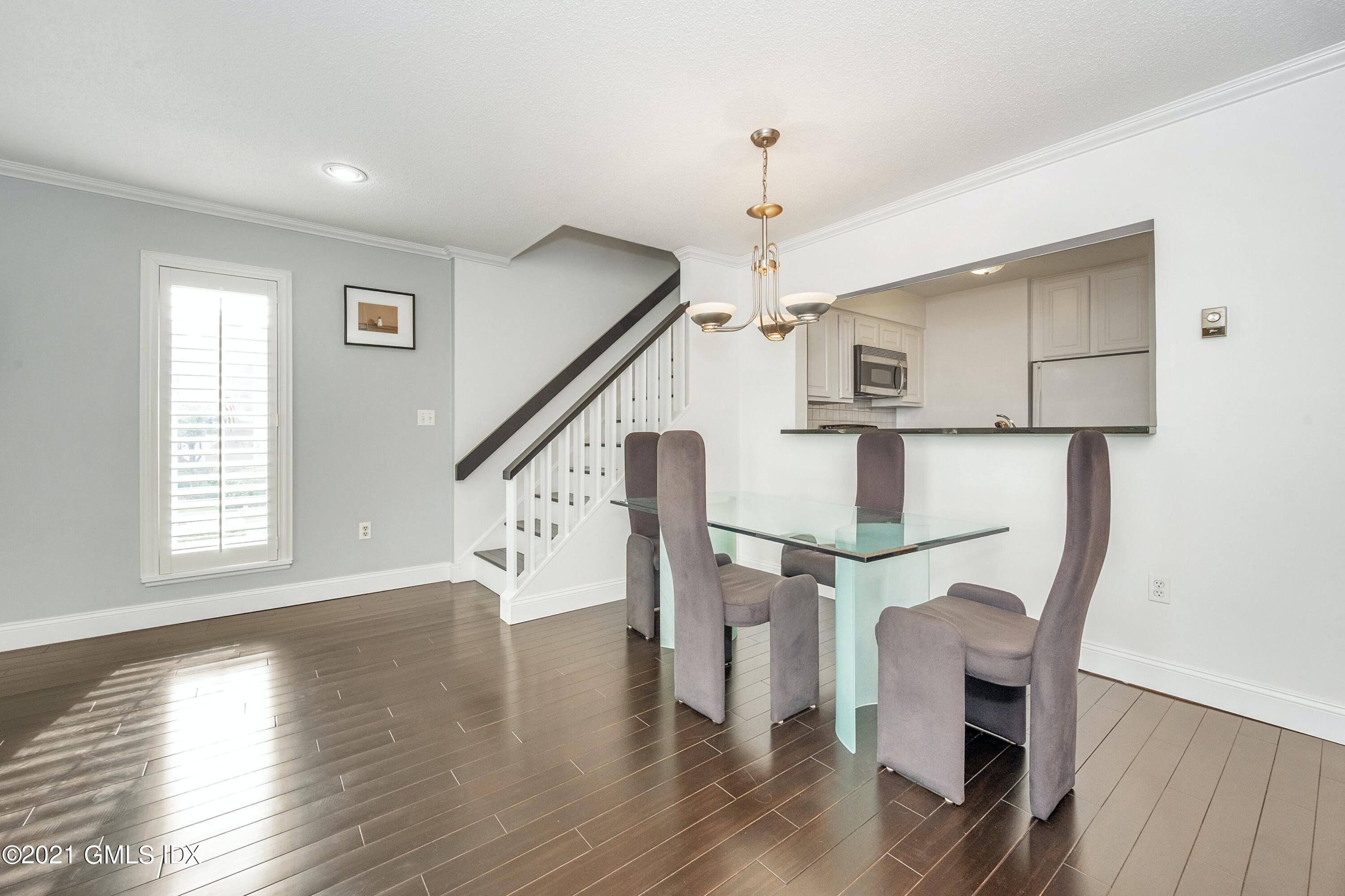 7 River Road, Unit 303 Cos Cob, CT 06807 - Photo 5 of 20 a view of entryway and hall with wooden floor
