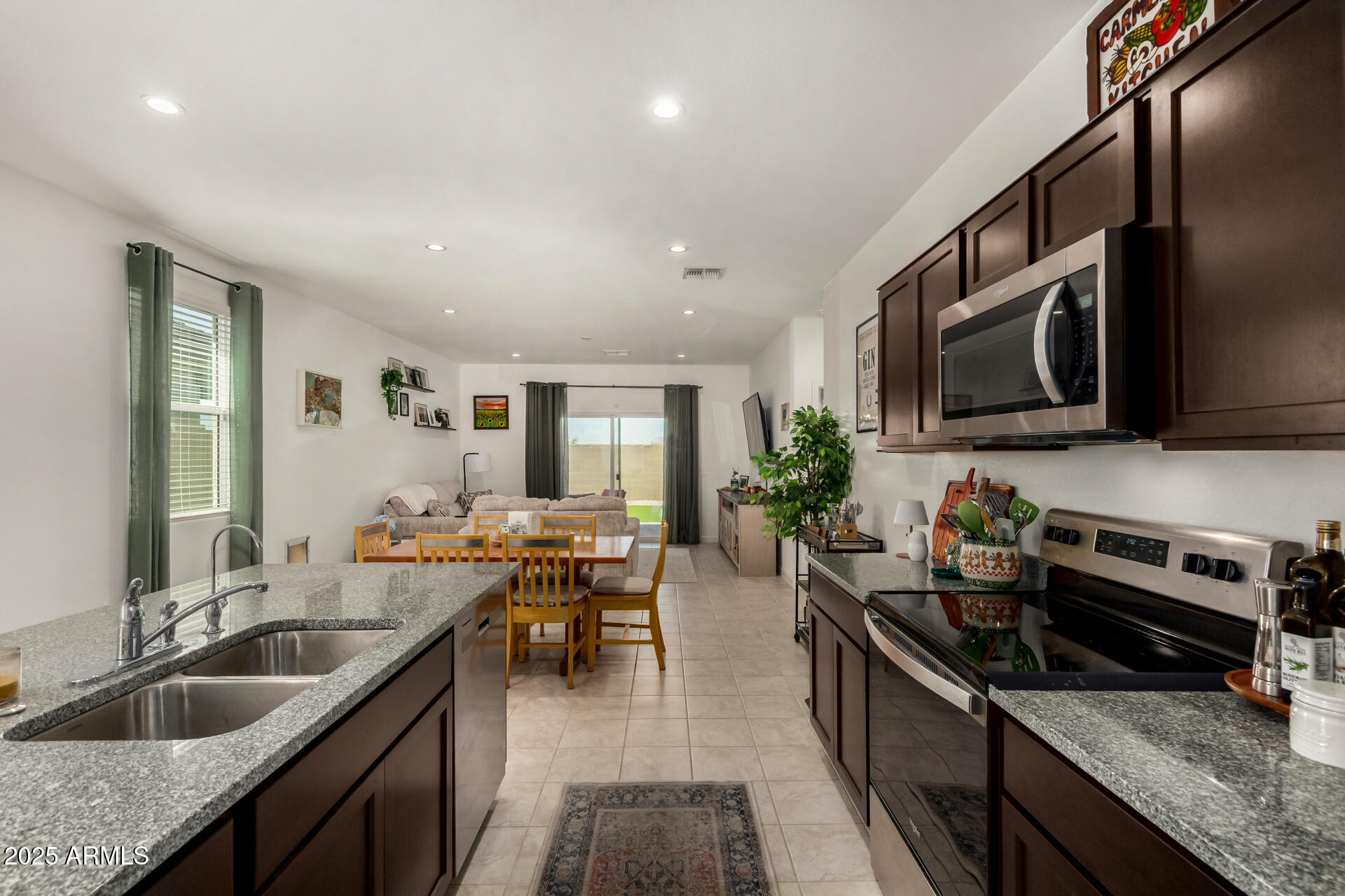 3226 West Stanton Avenue Apache Junction, AZ 85120 - Photo 13 of 34 a kitchen with sink stove and microwave