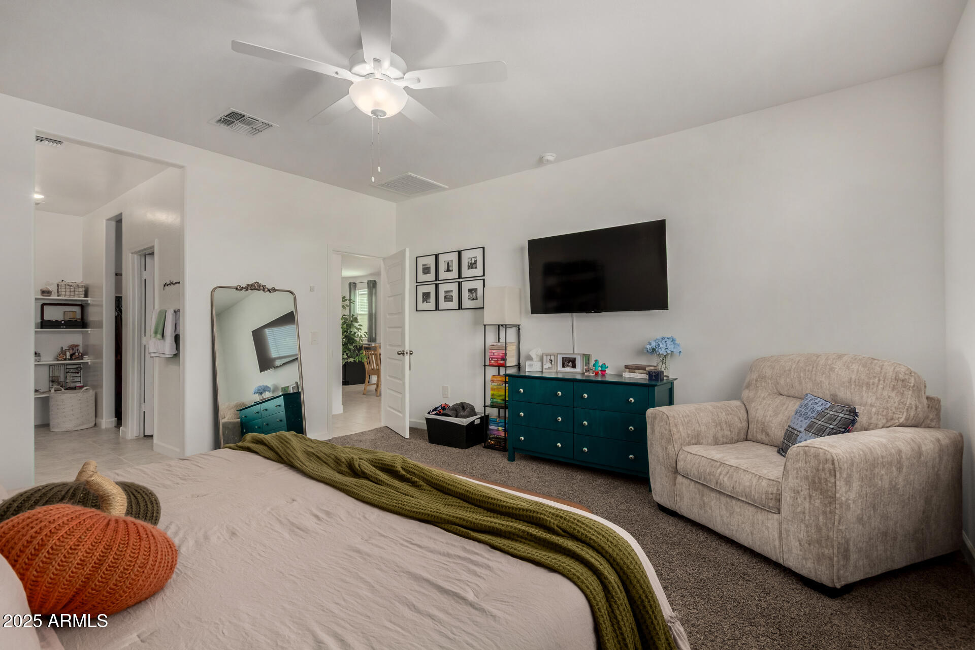 3226 West Stanton Avenue Apache Junction, AZ 85120 - Photo 15 of 34 a bedroom with a bed and a flat screen tv