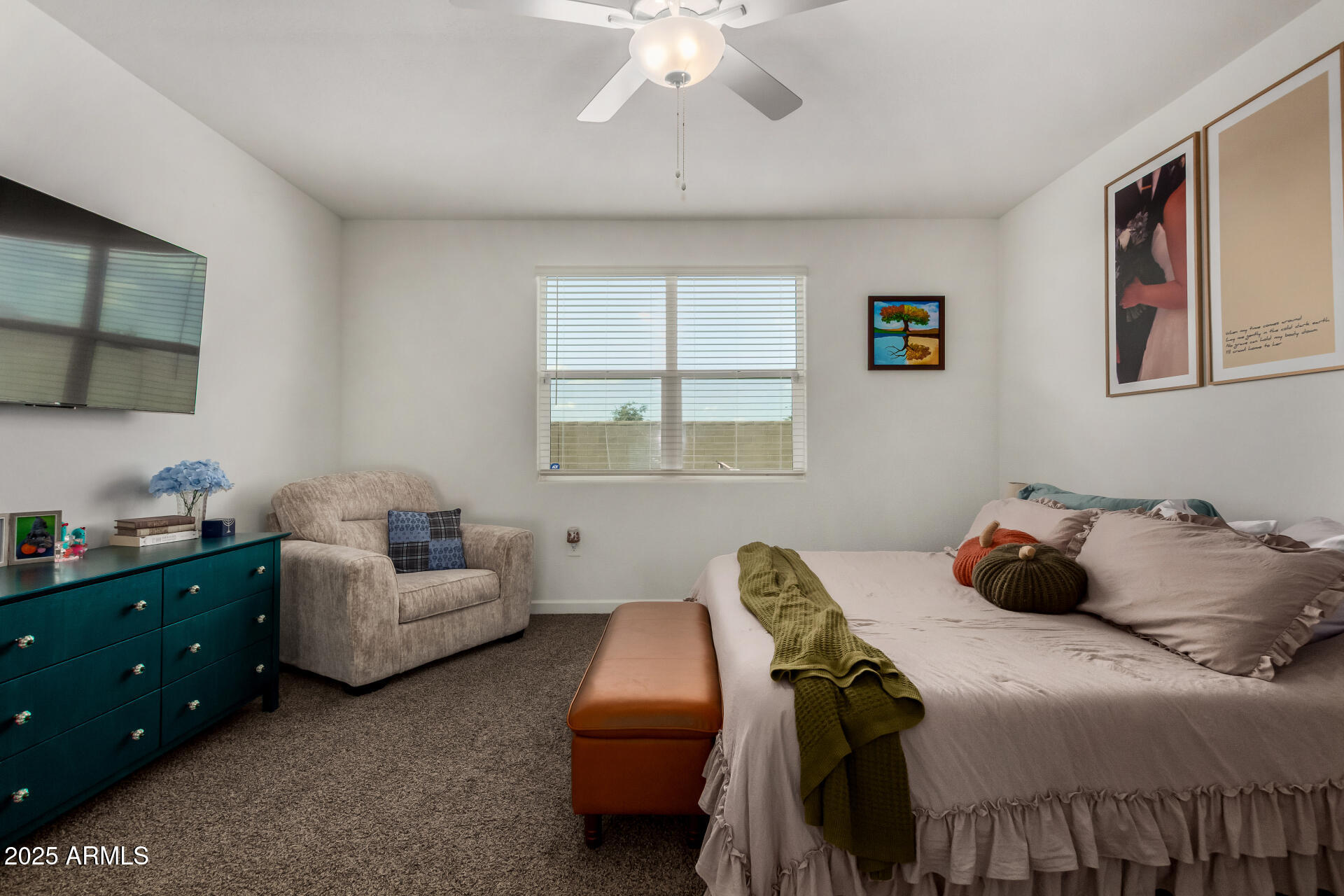 3226 West Stanton Avenue Apache Junction, AZ 85120 - Photo 16 of 34 a bedroom with a bed and a couch