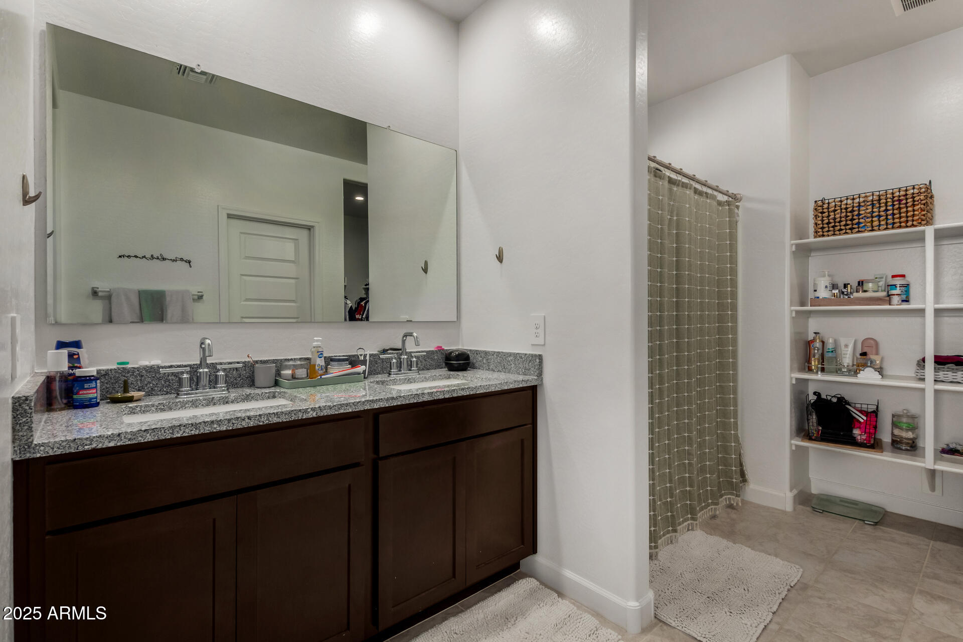 3226 West Stanton Avenue Apache Junction, AZ 85120 - Photo 17 of 34 a bathroom with a sink and a mirror