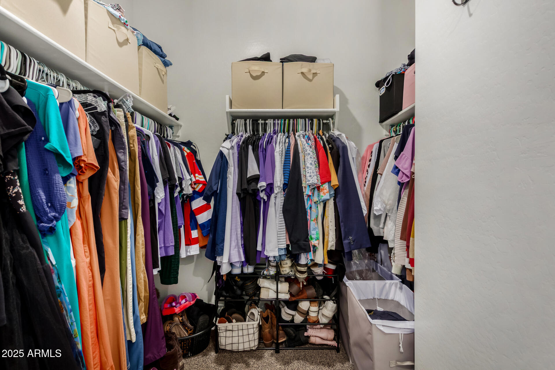 3226 West Stanton Avenue Apache Junction, AZ 85120 - Photo 19 of 34 a view of walk in closet with clothes and shoes