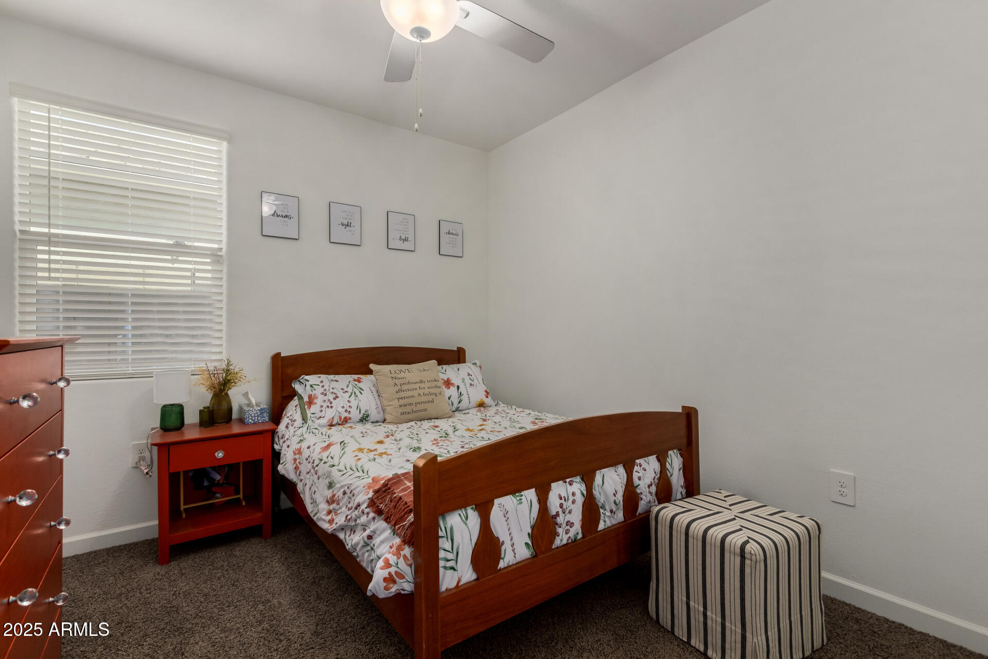 3226 West Stanton Avenue Apache Junction, AZ 85120 - Photo 20 of 34 a bedroom with a bed and a chair