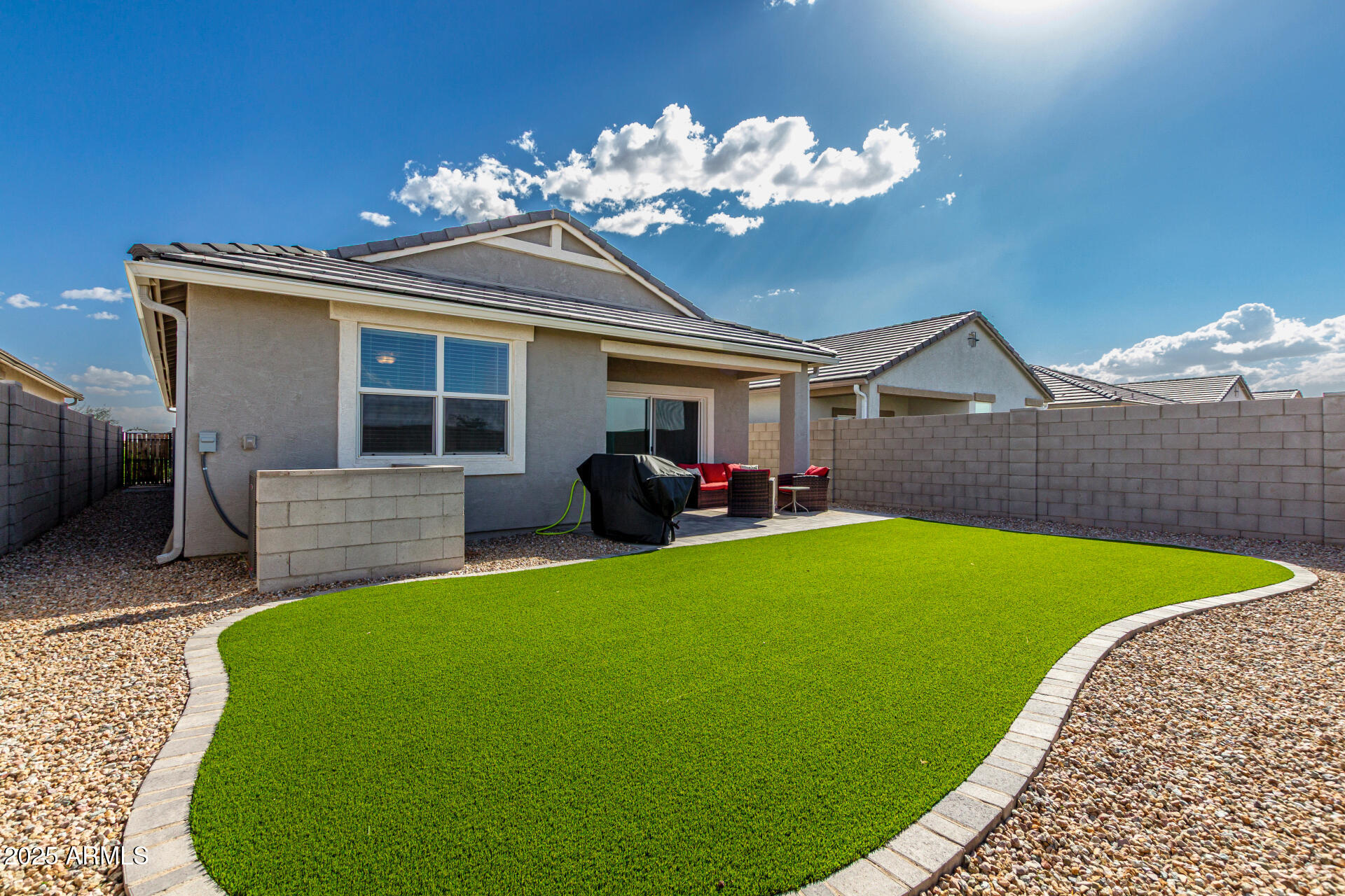 3226 West Stanton Avenue Apache Junction, AZ 85120 - Photo 31 of 34 a view of a house with a backyard