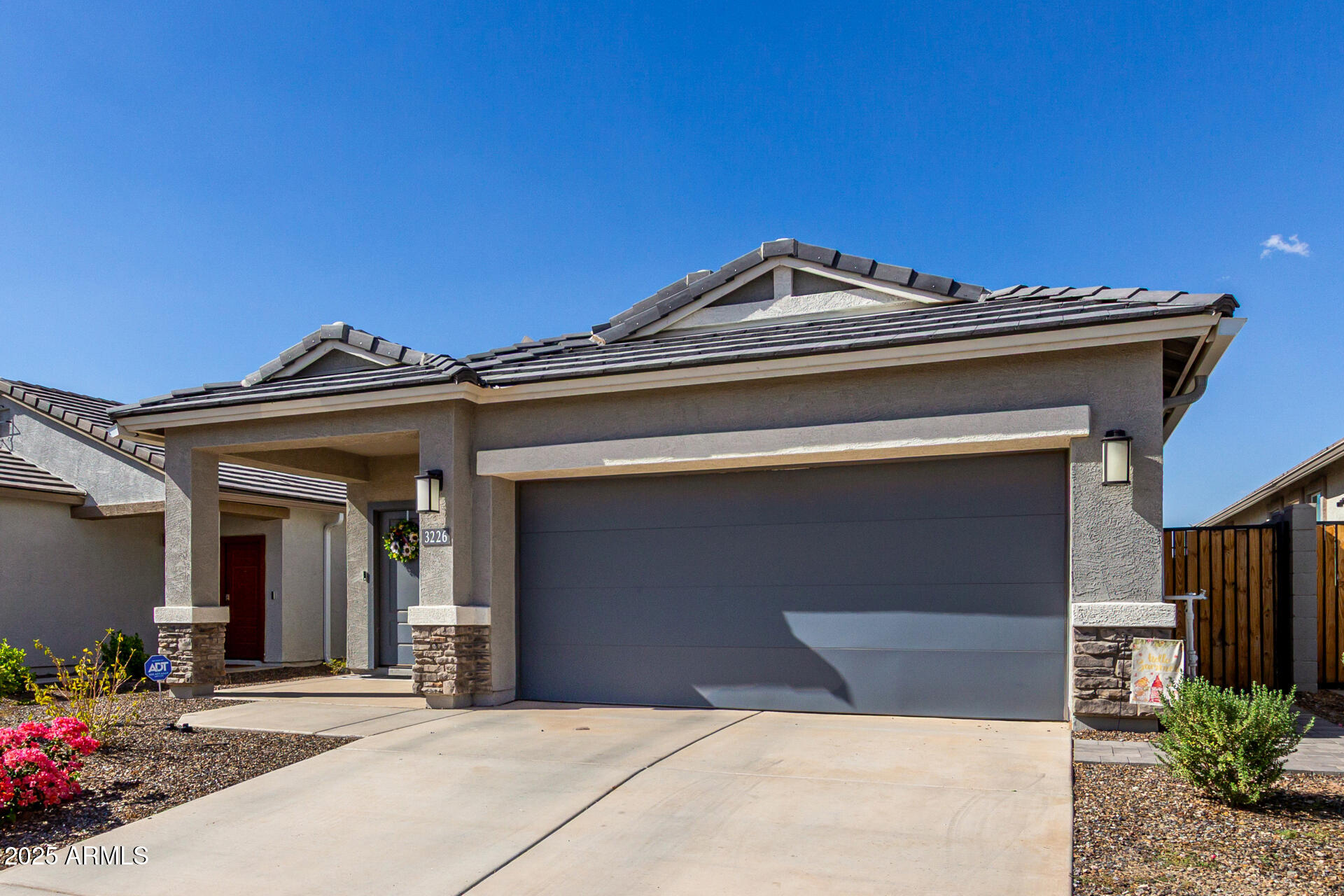 3226 West Stanton Avenue Apache Junction, AZ 85120 - Photo 4 of 34 a view of a building with a bench