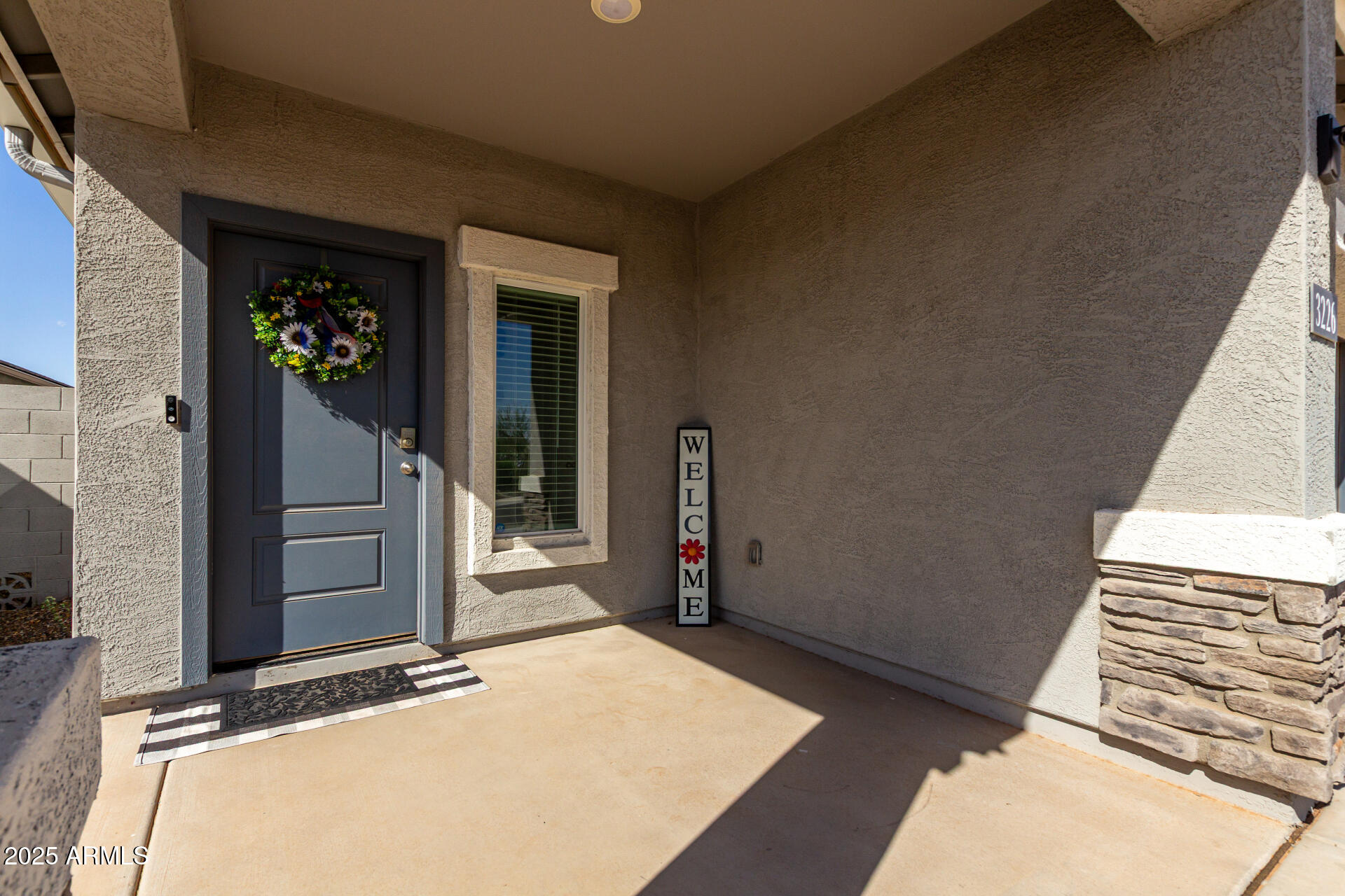 3226 West Stanton Avenue Apache Junction, AZ 85120 - Photo 7 of 34 a view of a door and chair in the house
