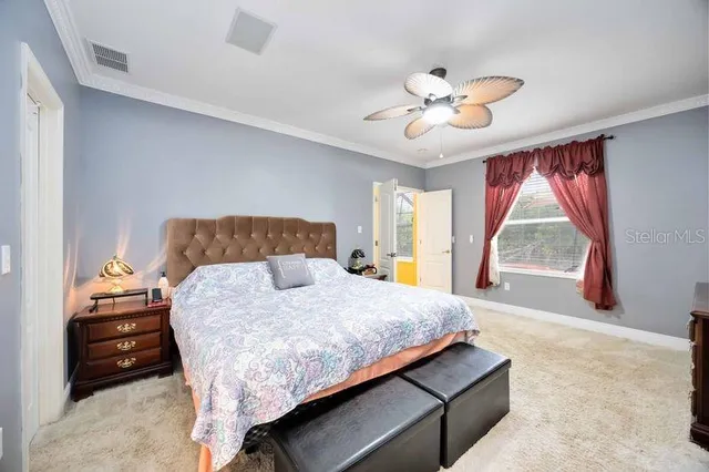 a bedroom with a bed and window