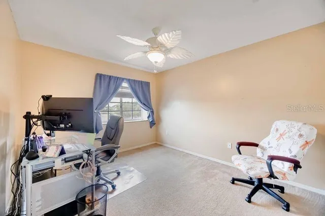 a workspace with furniture and a window