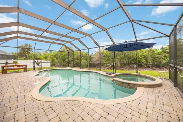 a view of a swimming pool with a porch