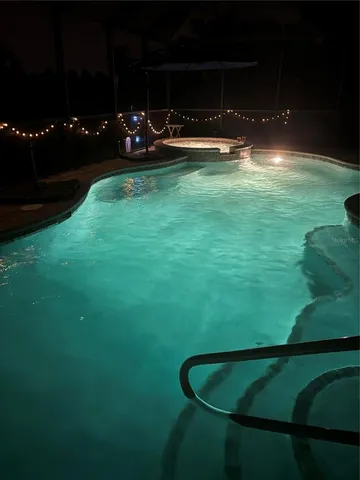 a view of a golf course with a swimming pool