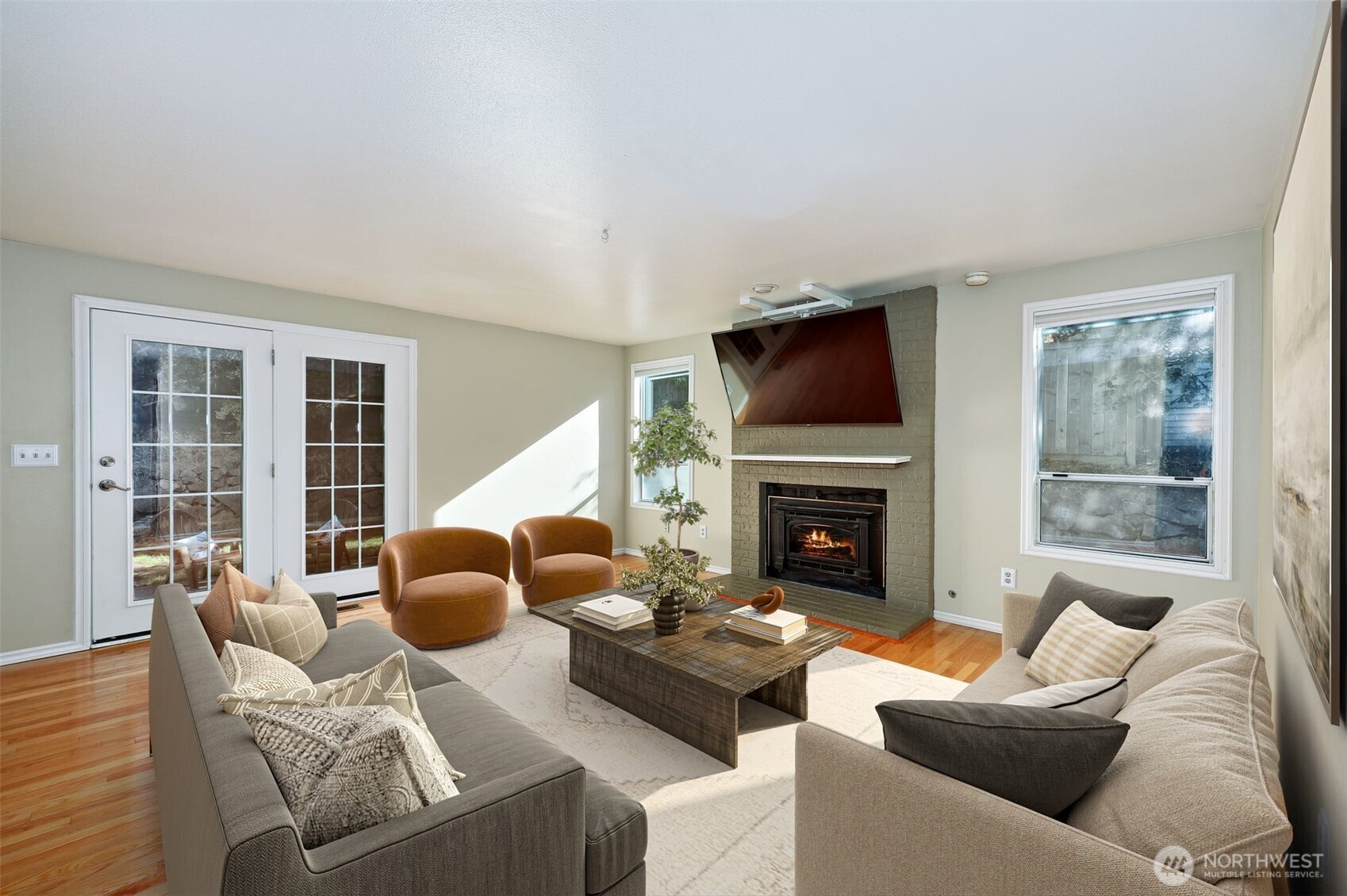 12281 Ridgepoint Circle Northwest Silverdale, WA 98383 - Photo 14 of 37 a living room with furniture a fireplace and a large window