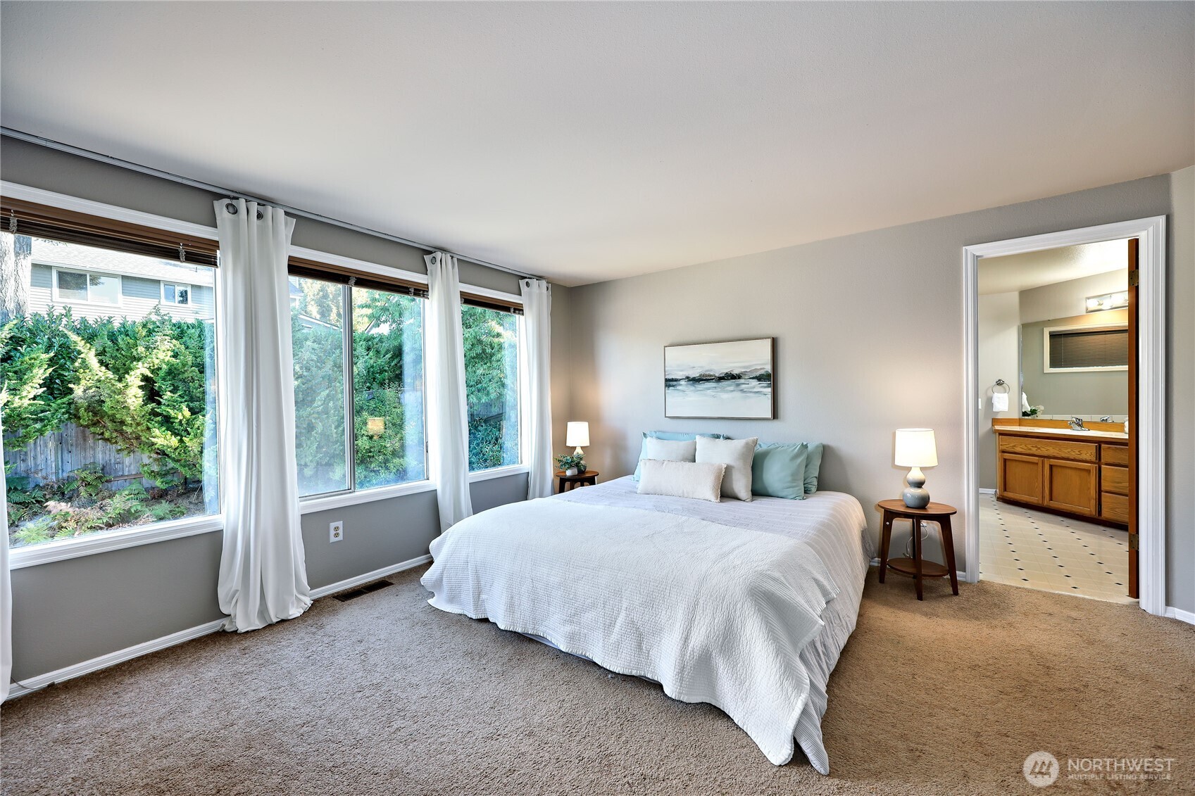 12281 Ridgepoint Circle Northwest Silverdale, WA 98383 - Photo 20 of 37 a bedroom with a bed and a large window