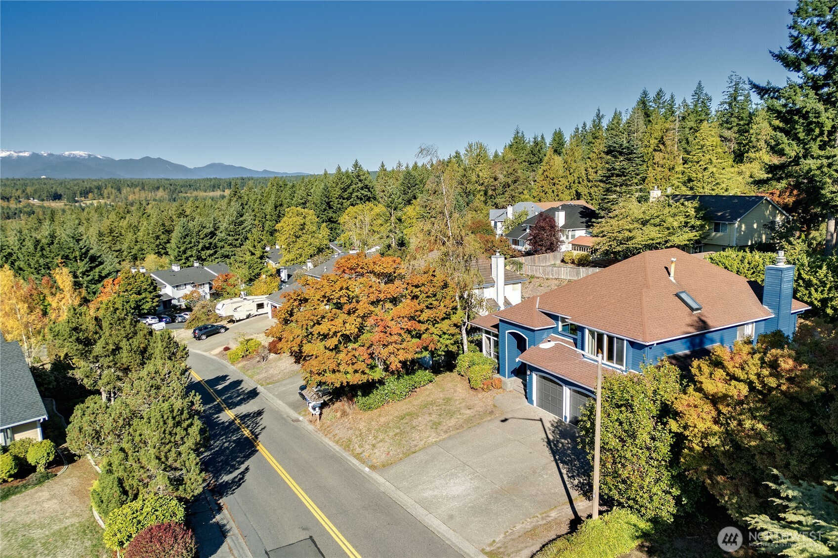 12281 Ridgepoint Circle Northwest Silverdale, WA 98383 - Photo 29 of 37 an aerial view of a house with a yard and lake view