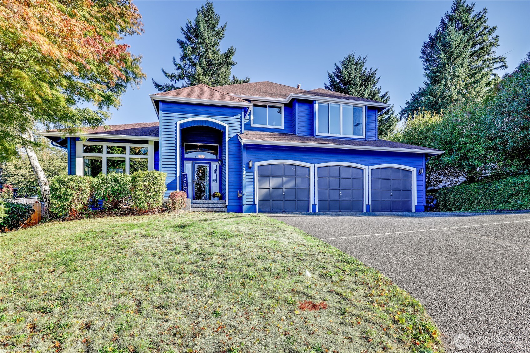 12281 Ridgepoint Circle Northwest Silverdale, WA 98383 - Photo 3 of 37 a front view of a house with yard