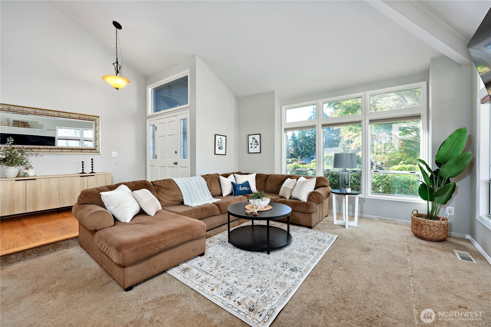 12281 Ridgepoint Circle Northwest Silverdale, WA 98383 - Photo 4 of 37 a living room with furniture potted plant and a window
