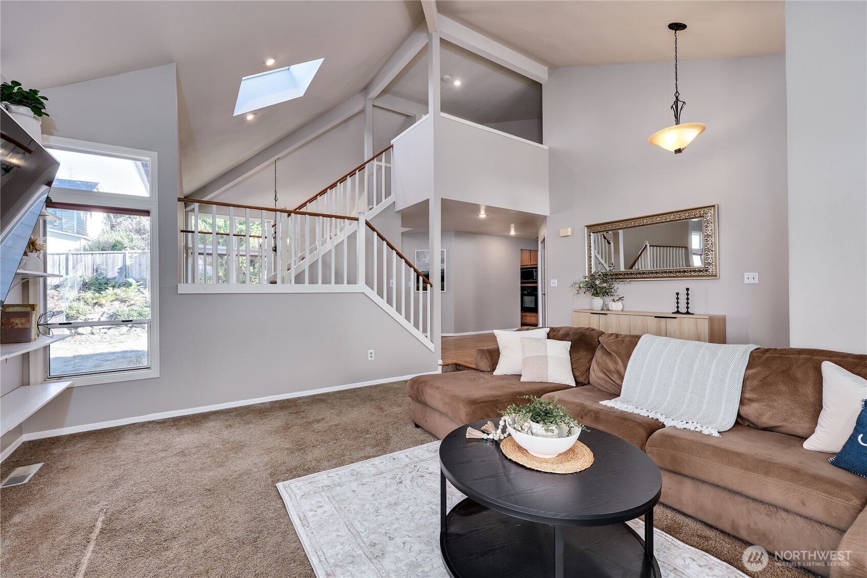 12281 Ridgepoint Circle Northwest Silverdale, WA 98383 - Photo 6 of 37 a living room with furniture and a window