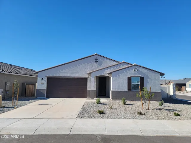 a front view of a house with garage