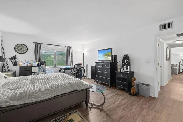 a view of walk in closet with clothes