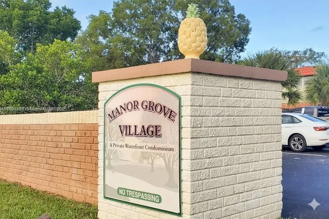 a living room with furniture flat screen tv and wooden floor
