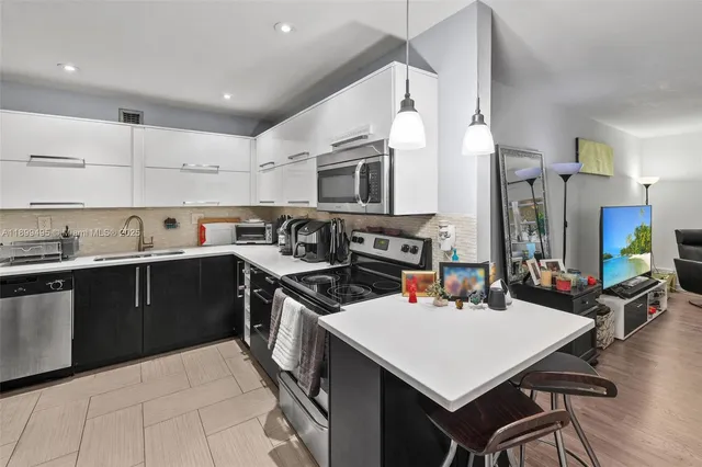 a kitchen with a stove and a sink