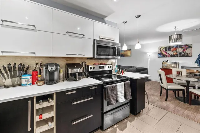 a living room with furniture rug and window
