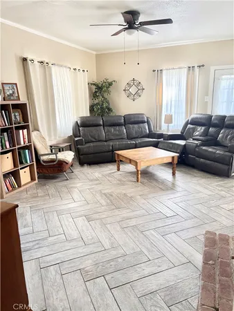 a living room with furniture and a book shelf