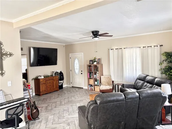 a living room with furniture and a flat screen tv