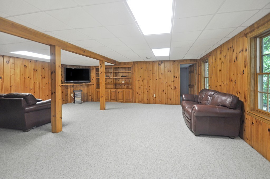 65 College Road Concord, MA 01742 - Photo 12 of 13 a living room with furniture and a flat screen tv