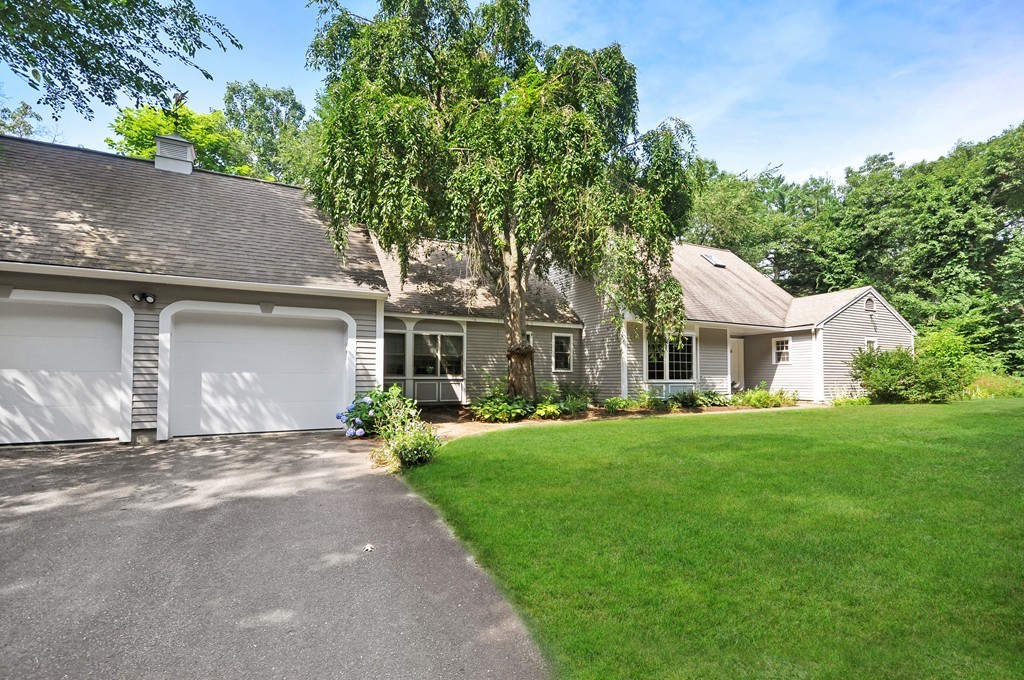 65 College Road Concord, MA 01742 - Photo 2 of 13 front view of a house with a garden