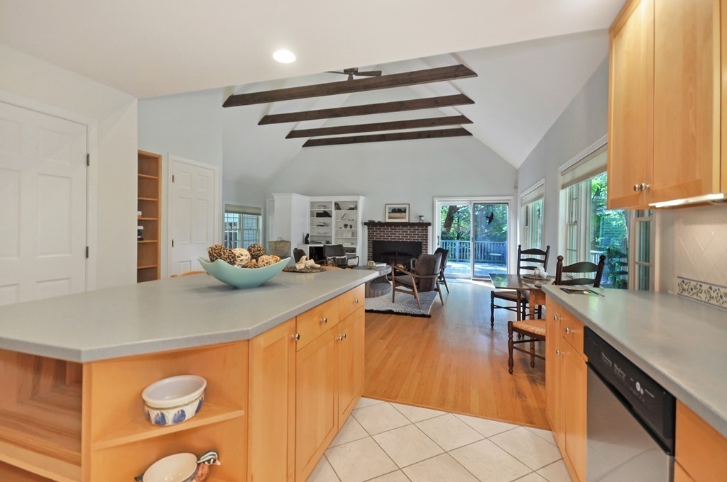 65 College Road Concord, MA 01742 - Photo 5 of 13 a kitchen with stainless steel appliances granite countertop a sink a stove and a refrigerator