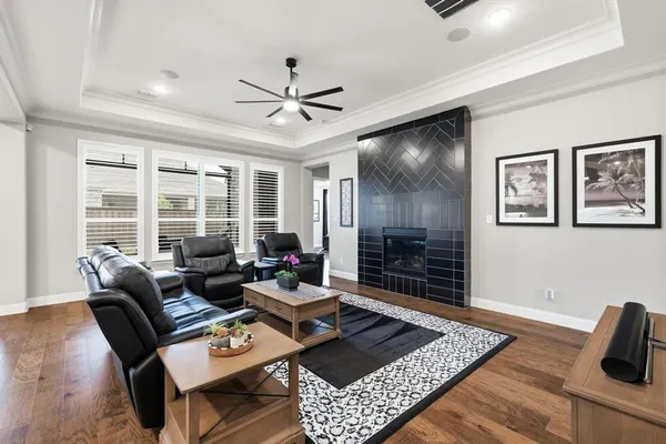 a living room with furniture a rug and a window