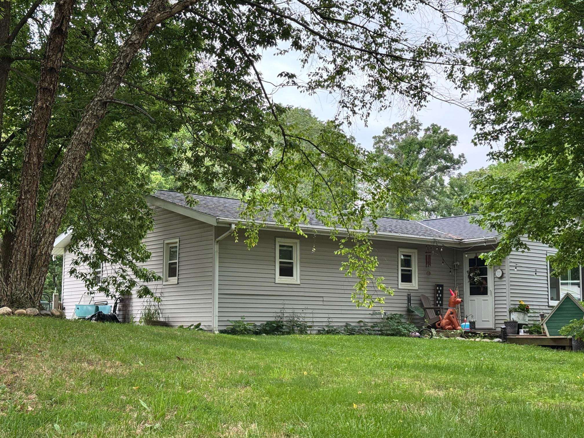 11371 Havenswood Road Roscoe, IL 61073 - Photo 6 of 24 a front view of a house with a garden