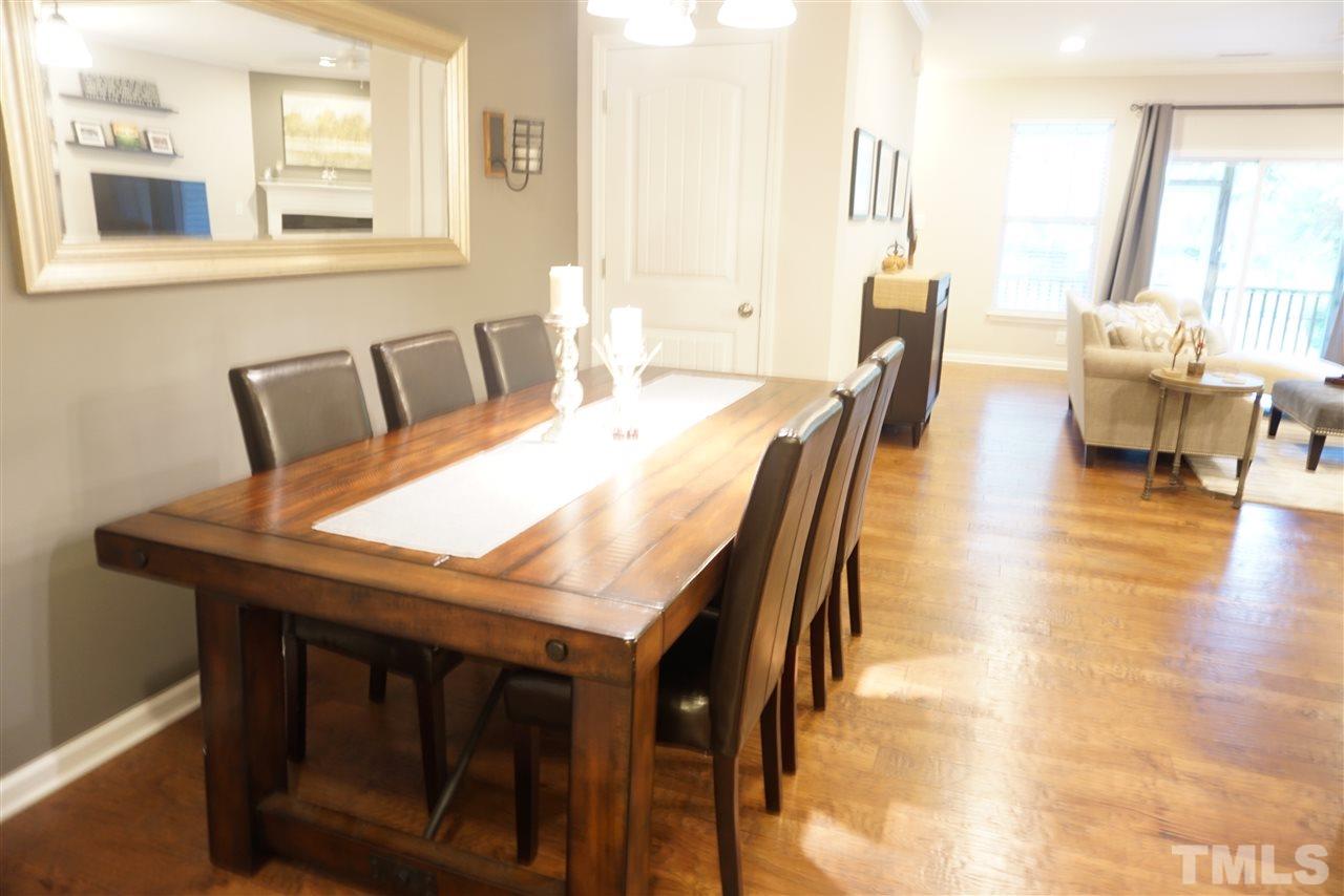 2411 Memory Ridge Drive Raleigh, NC 27606 - Photo 4 of 25 Upgraded 5 inch hardwood floors throughout main level.