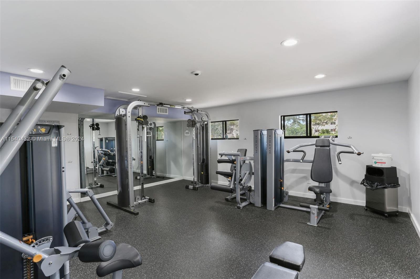 7785 Southwest 86th Street, Unit E116 Miami, FL 33143 - Photo 18 of 27 a view of a room with gym equipment