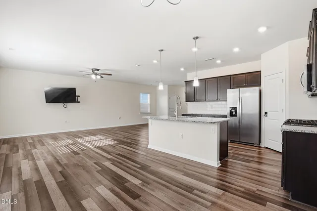 a kitchen with a refrigerator and a microwave