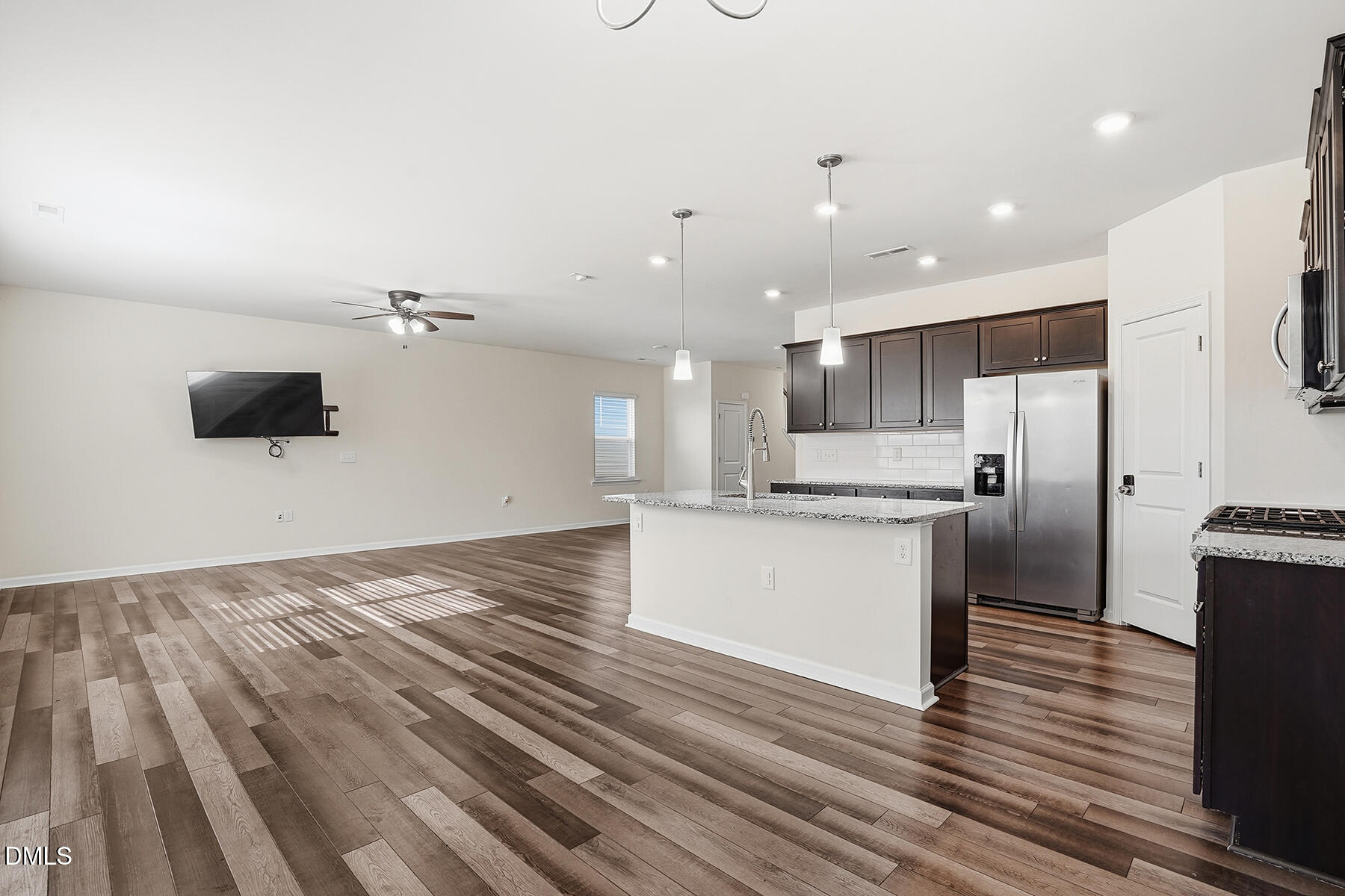 2116 Water Marsh Trail Fuquay-Varina, NC 27526 - Photo 13 of 28 a kitchen with a refrigerator and a microwave