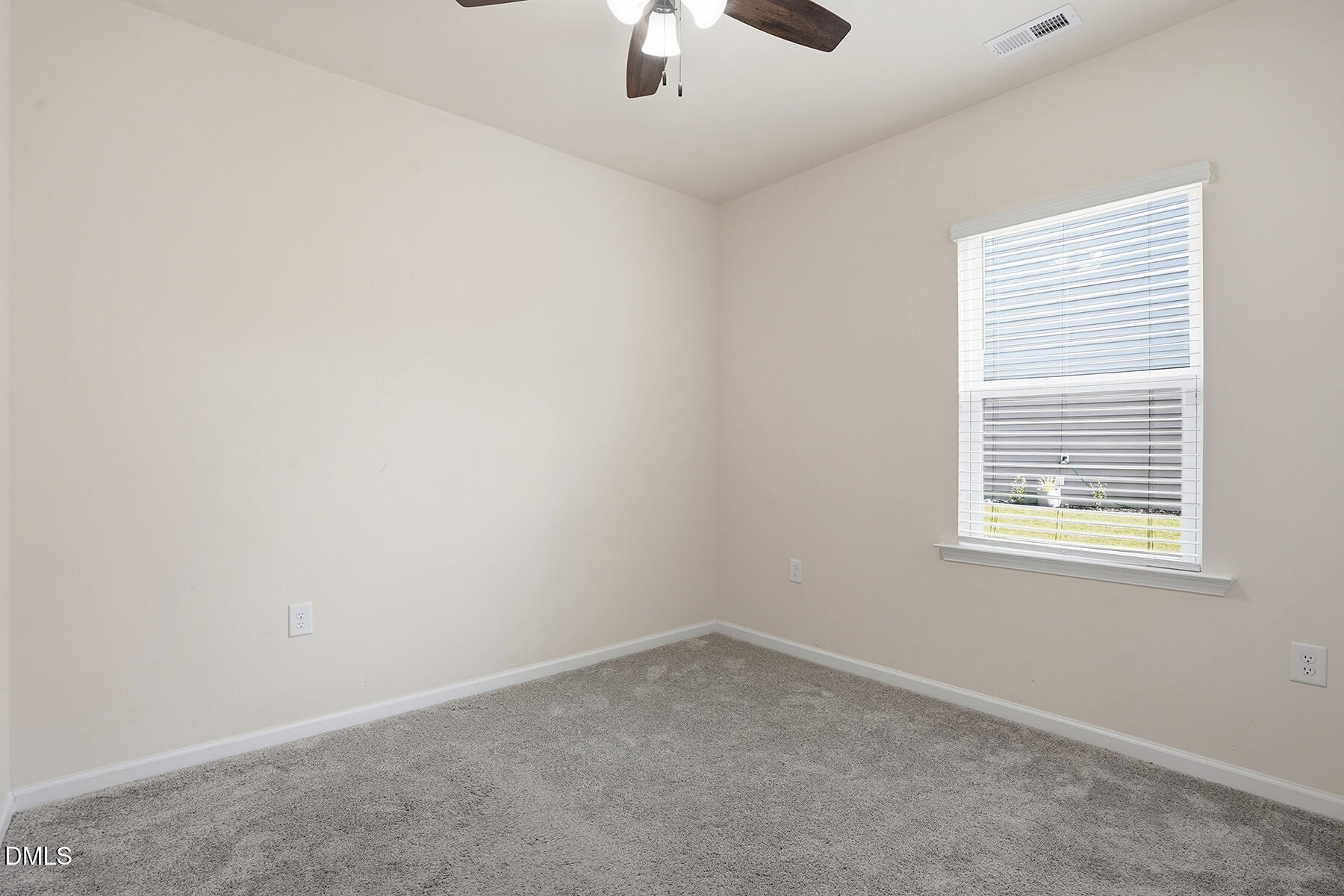 2116 Water Marsh Trail Fuquay-Varina, NC 27526 - Photo 14 of 28 an empty room with a window and a ceiling fan