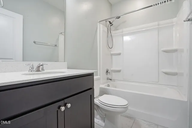 a bathroom with a sink a toilet and a bathtub