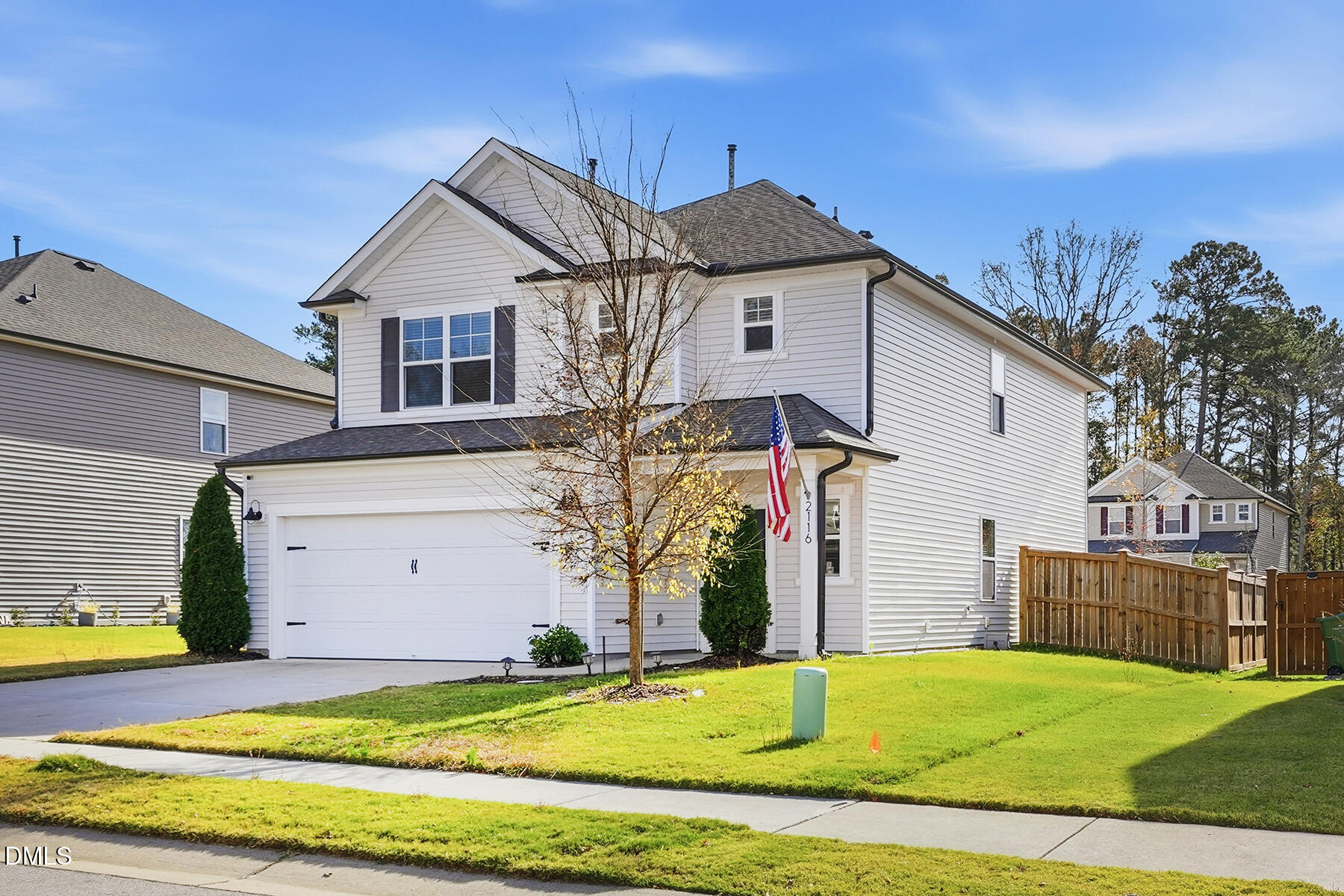2116 Water Marsh Trail Fuquay-Varina, NC 27526 - Photo 2 of 28 a view of a house with a yard and garage