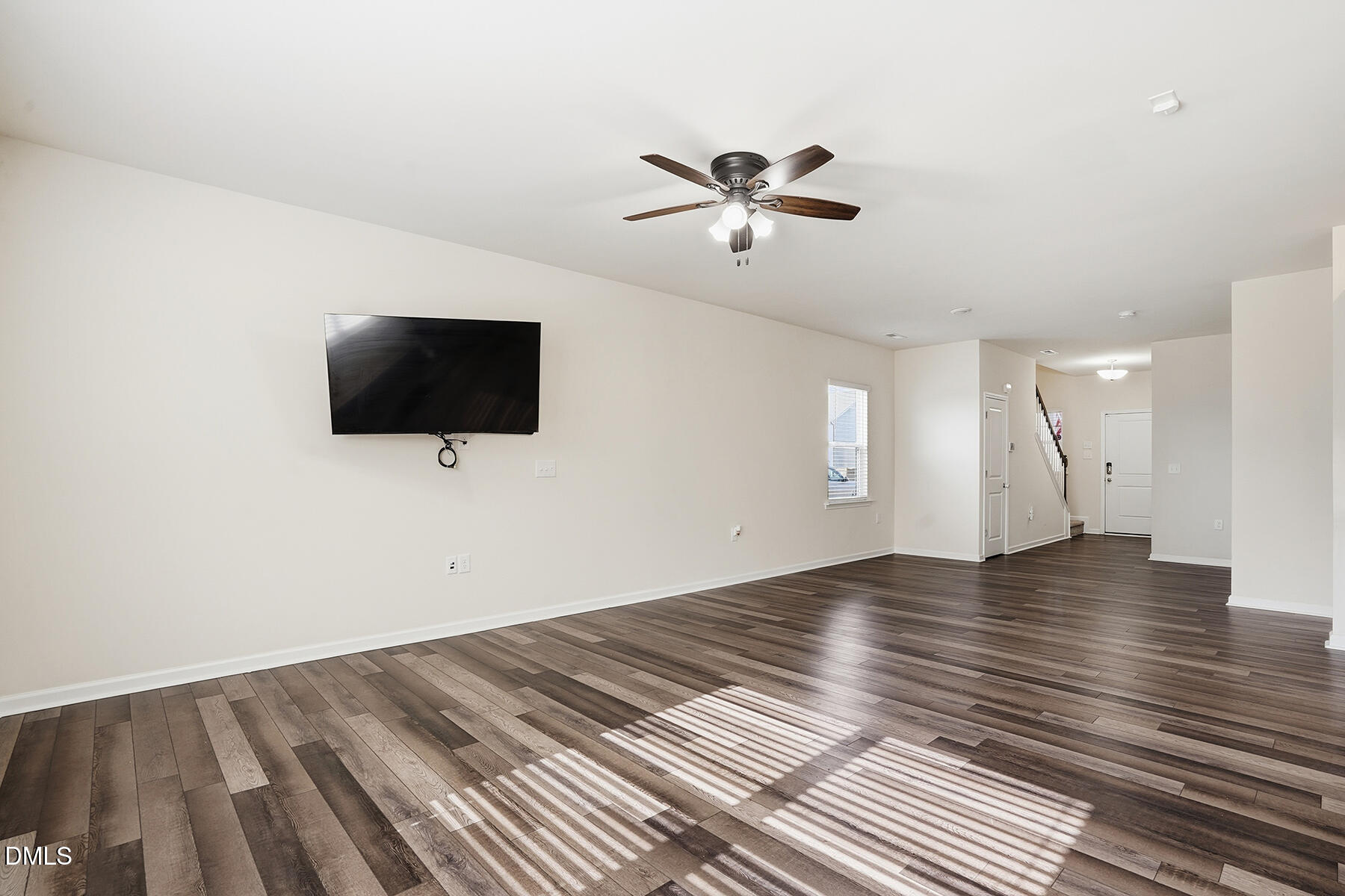 2116 Water Marsh Trail Fuquay-Varina, NC 27526 - Photo 6 of 28 a view of empty room with wooden floor and fan